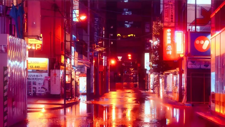 Rue commerçante de nuit, éclairée aux néons et reflétée sur la chaussée mouillée